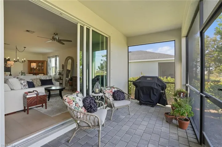 Sunroom featuring an outdoor hangout area.