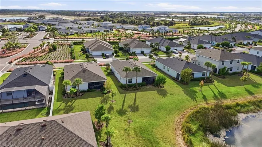 Aerial perspective of suburban area with a large body of water