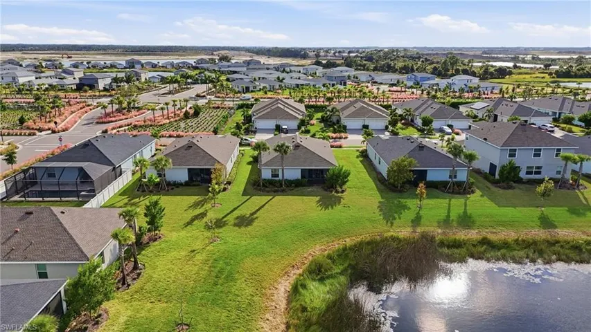 Aerial perspective of suburban area with a large body of water