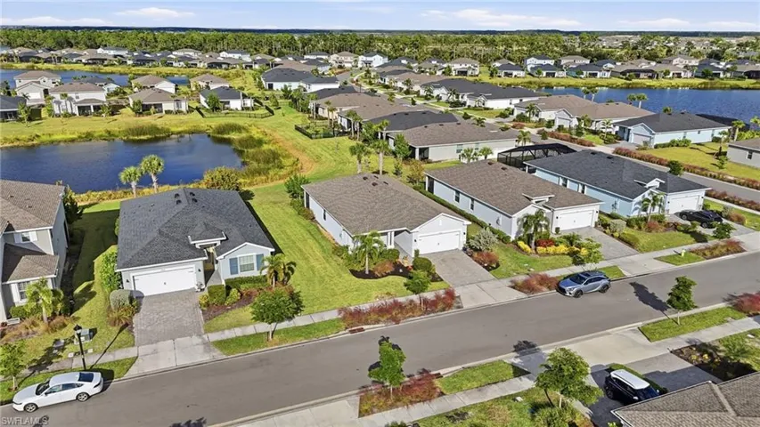 Aerial perspective of suburban area with a nearby body of water