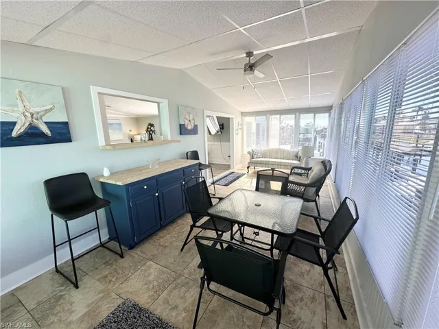 Florida room with pass-through window to kitchen