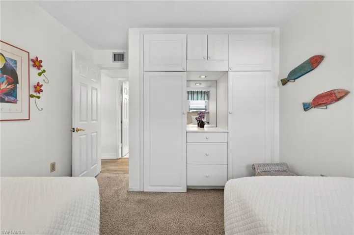 Bedroom with light carpet
