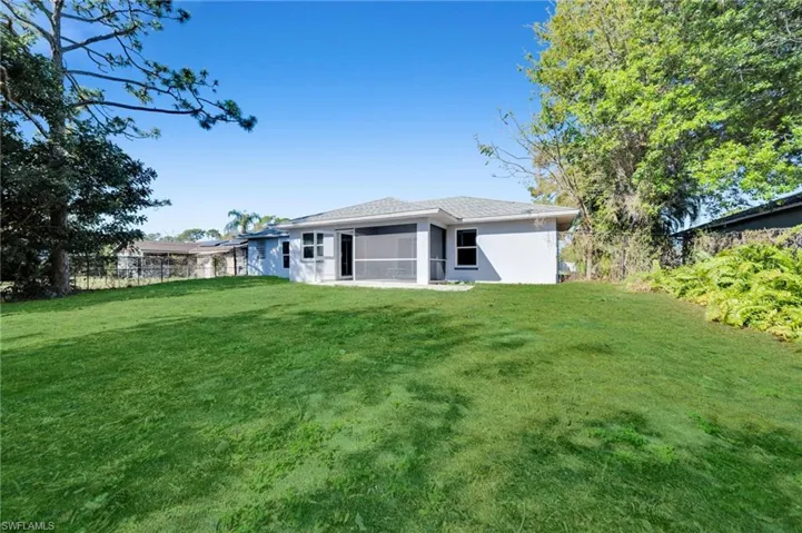 NICE Completely fenced back Yard with Enhanced photo