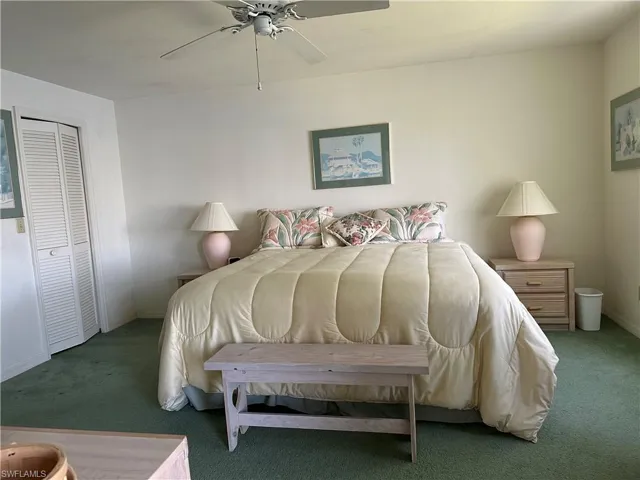 Bedroom featuring a closet, carpet floors, and ceiling fan