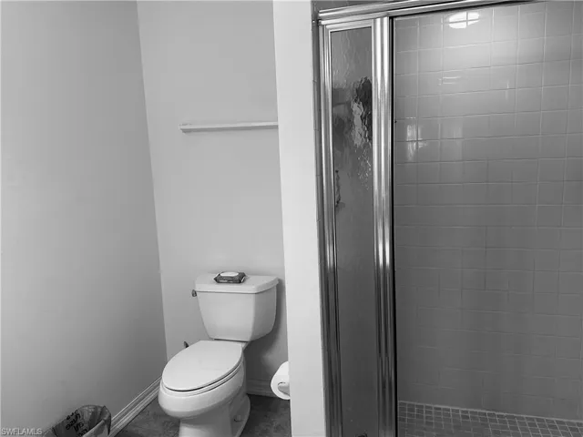 Bathroom featuring toilet and walk in shower