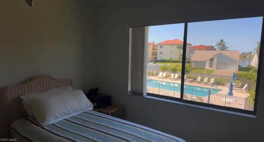 Bedroom featuring multiple windows