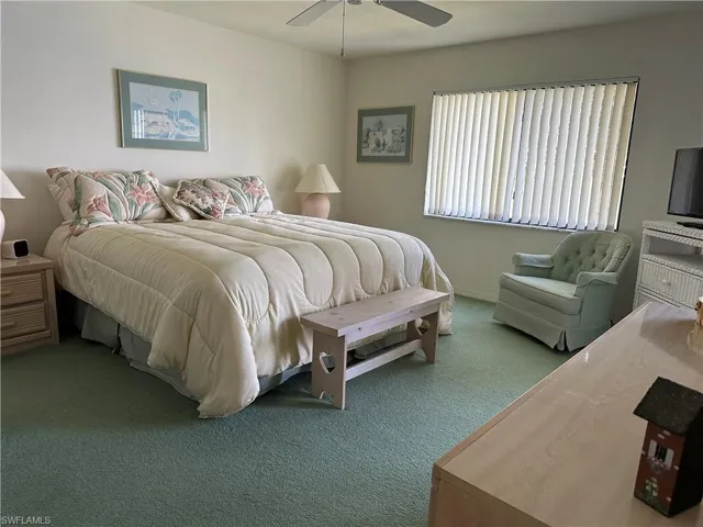Bedroom featuring carpet and ceiling fan