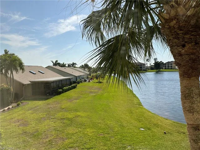View of yard with a water view