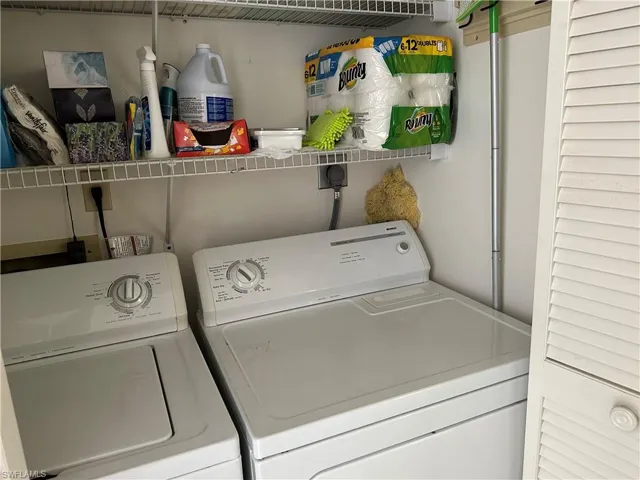 Laundry room featuring washing machine and clothes dryer
