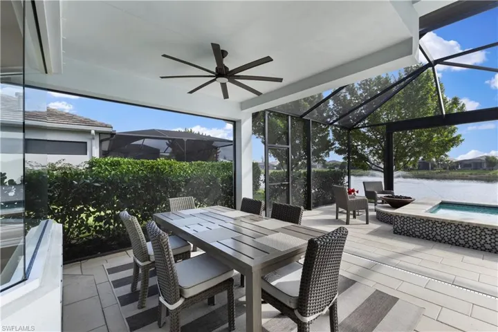 Great covered lanai space featuring a water view and ceiling fan
