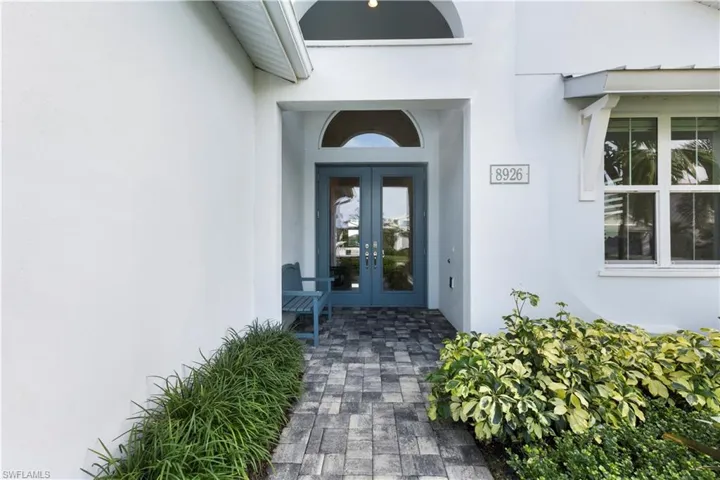 View of exterior entry featuring french doors