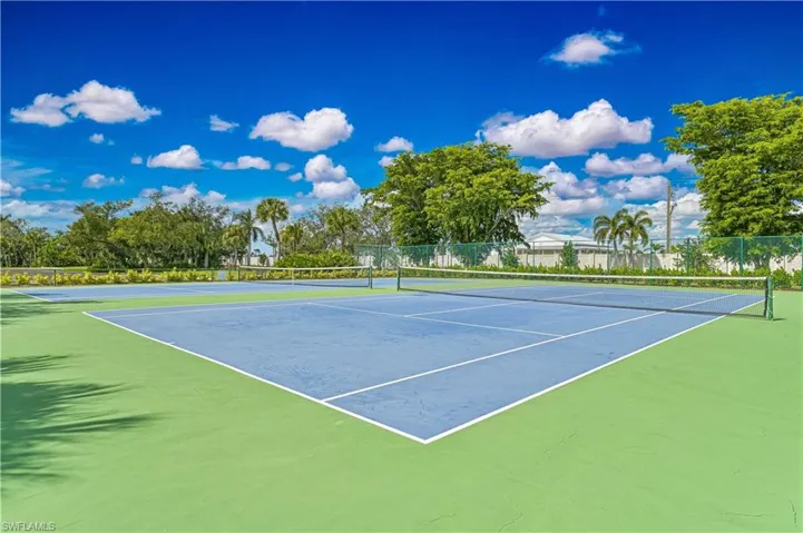View of tennis court with community basketball court