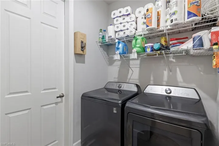 Washroom featuring washer and clothes dryer