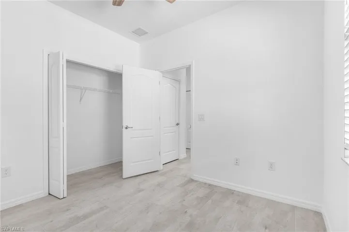 Guest room 2 with ceiling fan and large closet