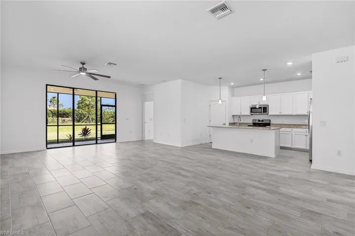 Open floor plan with tile throughout - NEW SEALED AND STAINED GROUT