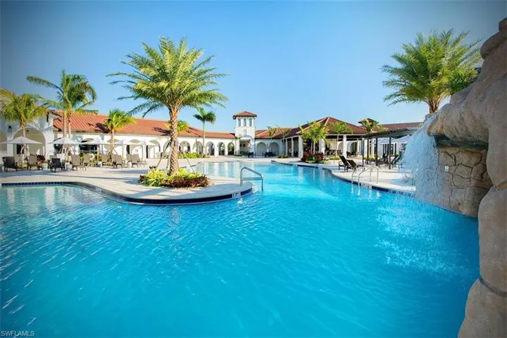 Community pool with a patio and bar/restaurant