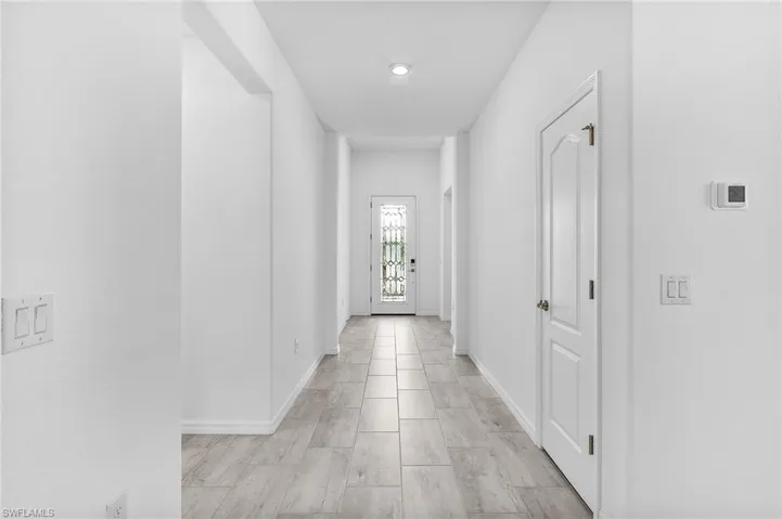 Entryway will recessed lighting and tile throughout - ample storage with hallway closets