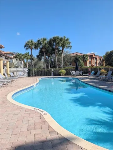 Community pool featuring a patio area