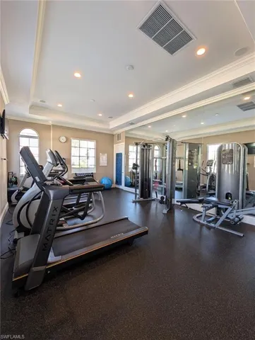 Workout area featuring crown molding and recessed lighting