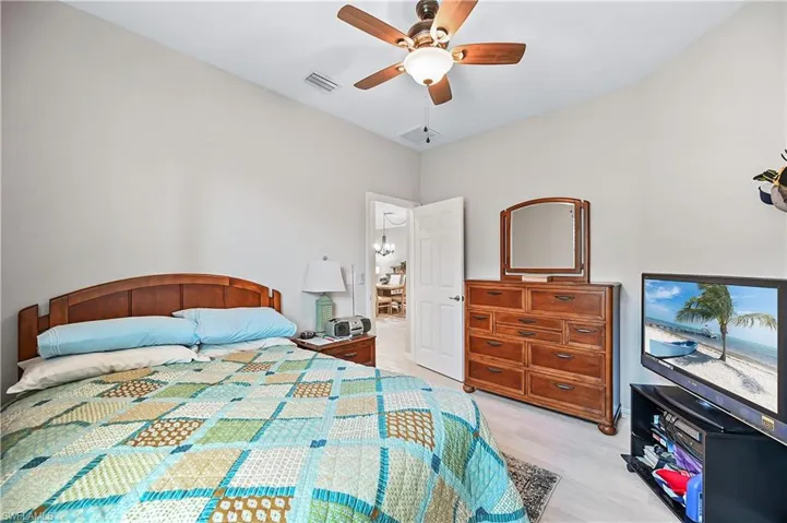 Bedroom featuring ceiling fan and light hardwood / wood-style flooring