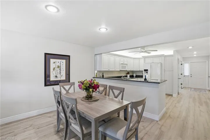 Dining area featuring recessed lighting, light LVP flooring, and ceiling fan