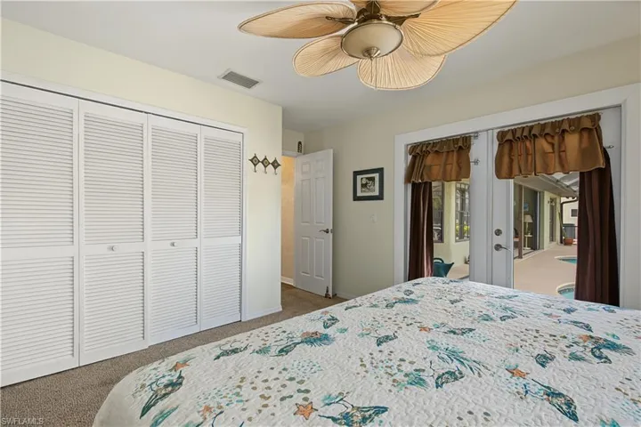 Bedroom 2 with sliders to pool