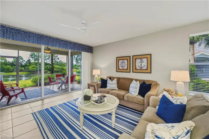 Living area with tile flooring and a screened patio