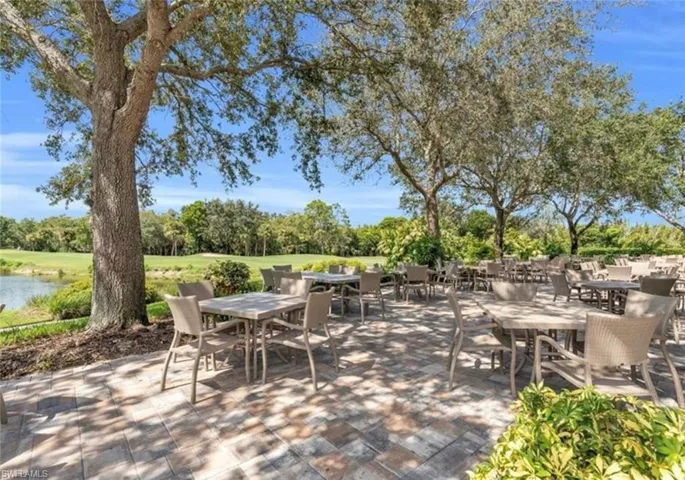View of patio / terrace featuring a water view and outdoor dining space
