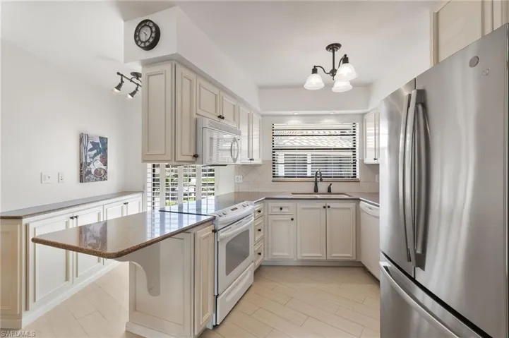 Modern cabinets, granite countertops, and more light