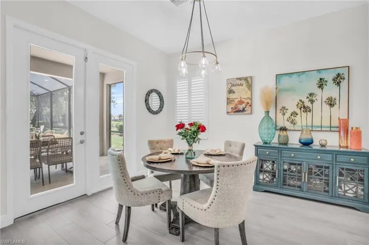 Dining room featuring an inviting chandelier and light wood-type flooring