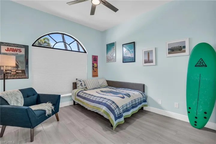 Bedroom featuring light hardwood / wood-style flooring and ceiling fan