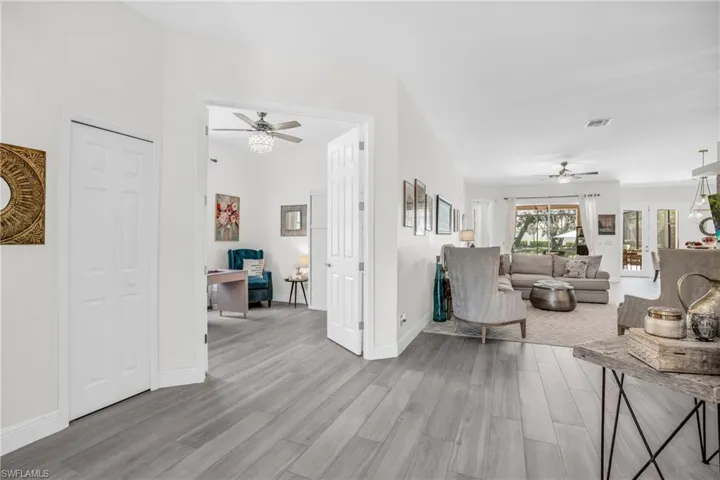 Unfurnished living room featuring light hardwood / wood-style flooring and ceiling fan