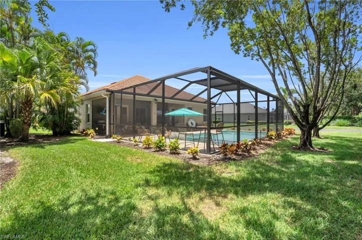 View of yard with glass enclosure