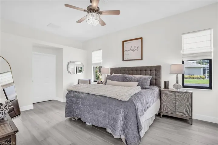 Bedroom featuring light wood-type flooring and ceiling fan