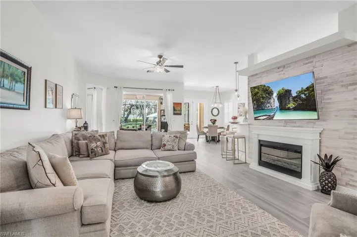 Living room featuring light hardwood / wood-style flooring and ceiling fan