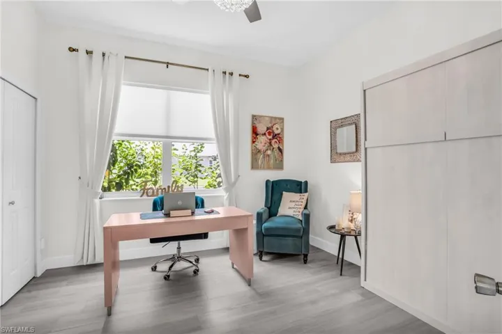 Office area featuring light hardwood / wood-style floors and ceiling fan