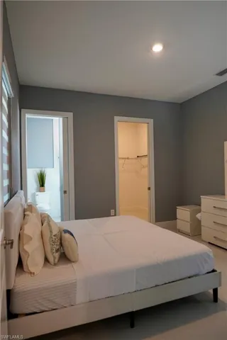 Bedroom featuring a spacious closet and recessed lighting