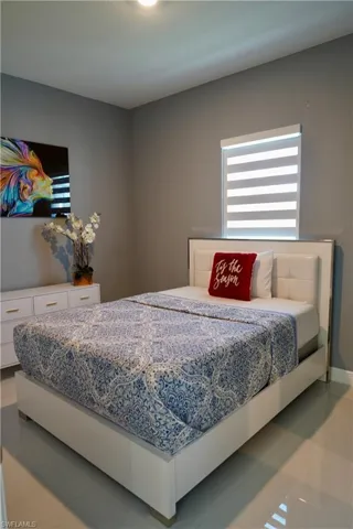 Bedroom featuring light tile patterned flooring
