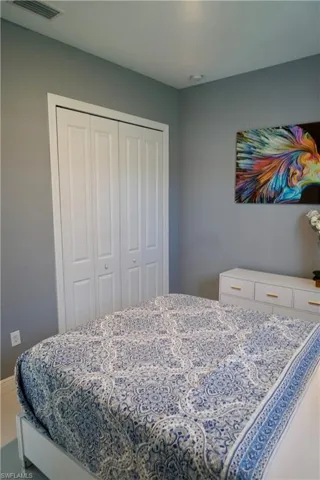 Bedroom with a closet and tile patterned floors