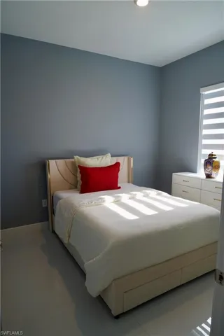 Bedroom featuring light tile patterned floors and recessed lighting