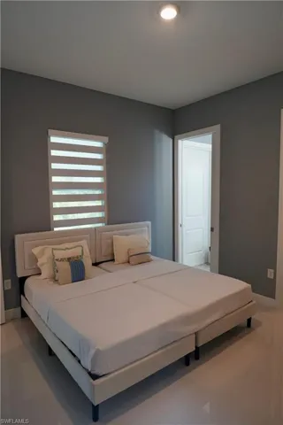 Bedroom featuring light tile patterned floors and recessed lighting