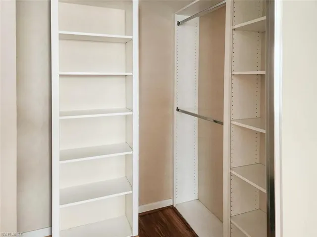 Walk in closet featuring wood finished floors