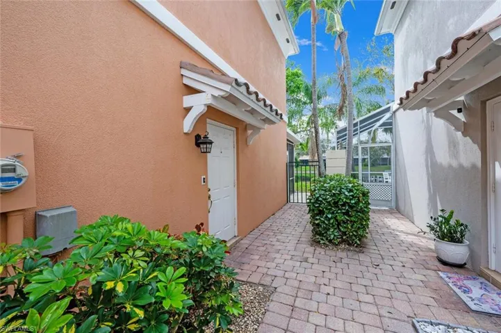 View of patio / terrace featuring a lanai