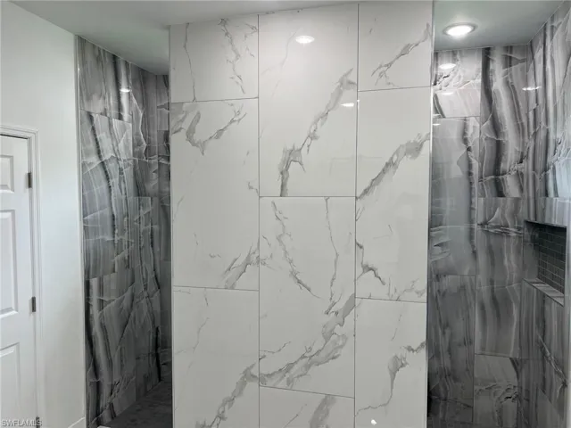 Bathroom featuring tiled shower