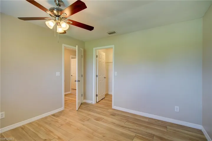 Spare room with light wood-style floors and ceiling fan