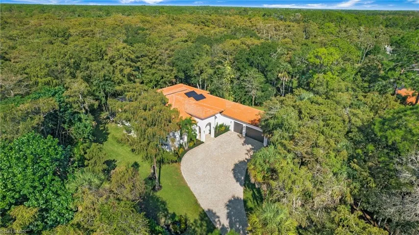 View from above of property featuring a forest