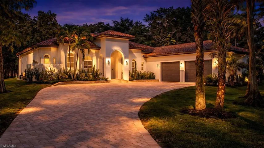 Virtually Staged Mediterranean / spanish-style home with decorative driveway, a front lawn, a garage, and stucco siding