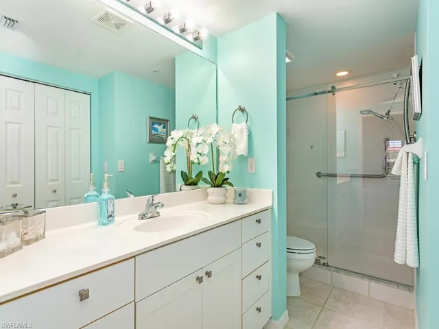 Owners Bath with oversized shower with glass barn door