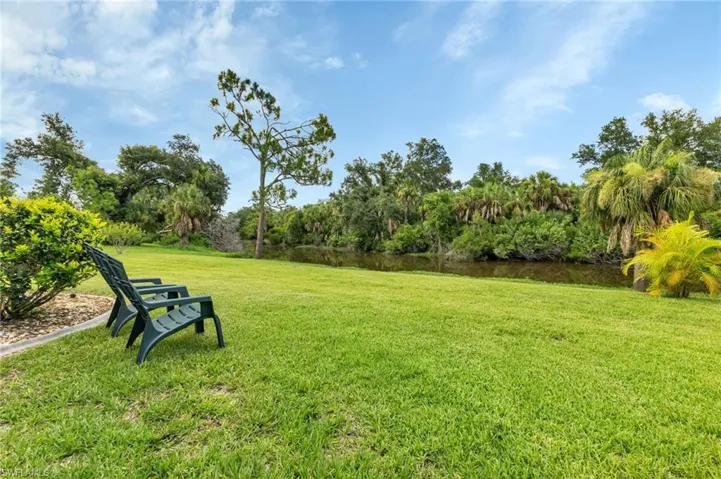 View of yard with a water view