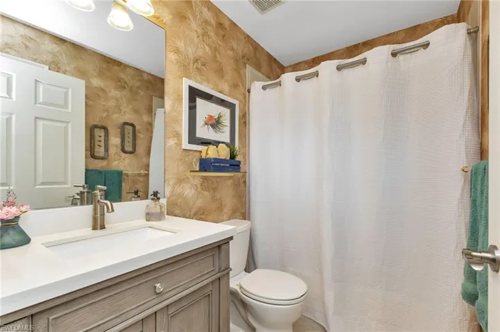 Bathroom with vanity and toilet